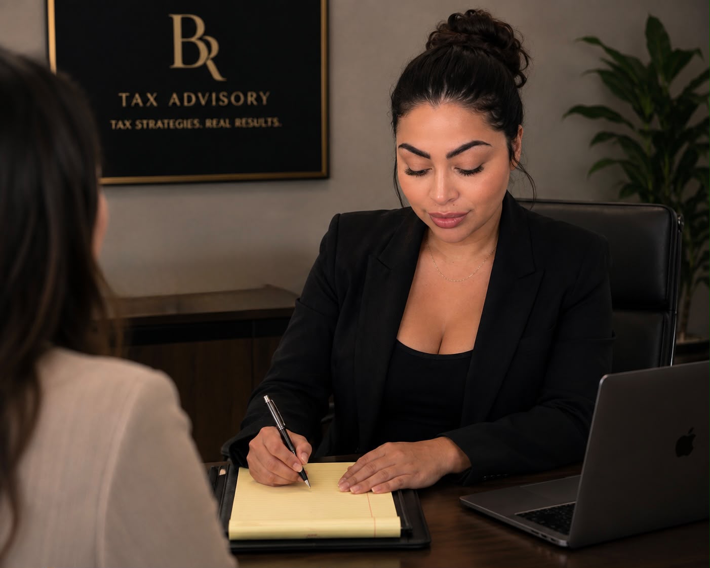 Brenda Reyes reviewing documents and preparing a client strategy